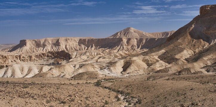 A landscape close to settlement Midreshet Ben-Gurion in Negev Desert. Conical in shape mount Hod Akev in the background. Wide view of Nahal Akev and Ramat Boker. The Israel Trail in the national park