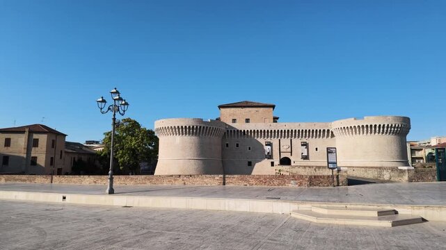 Rocca Roveresca Castle of Senigallia, Ancona with full day light in summer time. Building recently cleaned. Frontal view from Duca's Square. Horizontal footage panning.