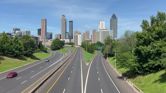 View of cars headed to and from downtown Atlanta on the freeway at Jackson Street Bridge in Georgia. 