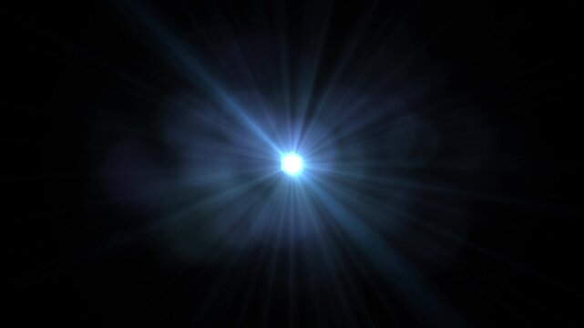 A bright white light with radiant beams spreading across a black background effect