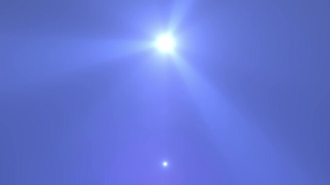 A clear, sunny day with bright sunlight illuminating a deep blue sky. The sun is high with a radiant flare