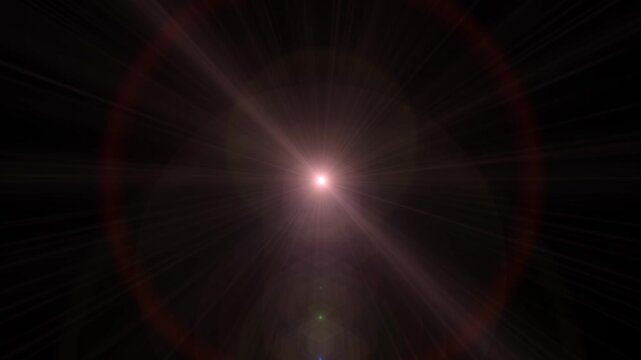 A dramatic lens flare effect with shining light rays, glow, and radiant spots across a dark background