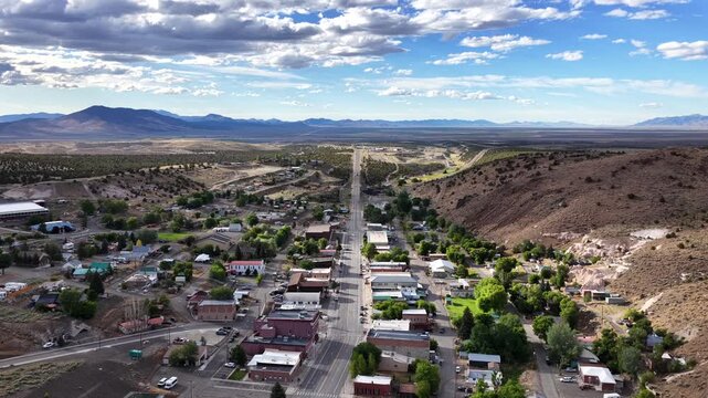 Eureka Nevada - Aerial Approaching Shot of Downtown Eureka NV Facing North on Summer Day with High Clouds