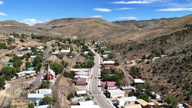 Austin Nevada - Low Aerial View of Highway 50 through Austin NV Facing East on Sunny Summer Day