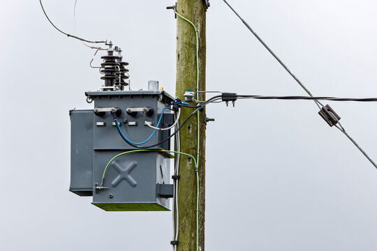 Close-up of pole mounted electrical distribution transformer and connections