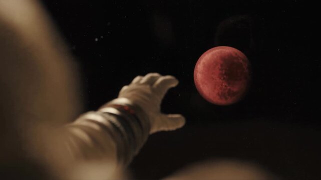 Astronaut drifts away from Mars after catastrophic accident in open space. Desperate hand reaches toward red planet with hope for survival