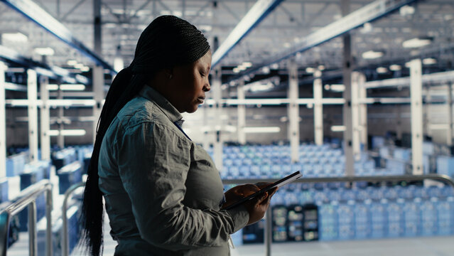 Software developer uses tablet in a data center to upgrade server hardware and improve workload capacity.