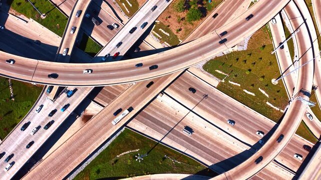 Vehicles, including cars and semi-trucks, are visible spread across the various lanes, lanes of gridlock, and exit ramps. Heavy traffic by the Jane Byrne Interchange in Chicago, Illinois, USA.