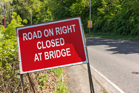 Road closed at bridge sign warning of temporary highway closure