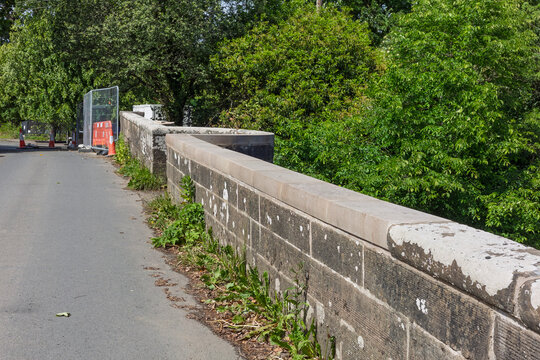 Historic stone bridge parapet during restoration and repair works