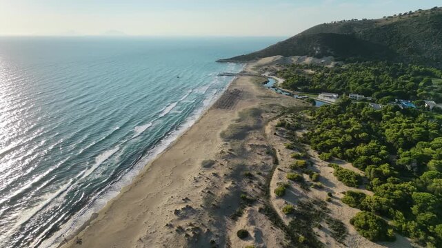 Kalogria, Achaea is a small coastal settlement and renowned sandy beach located in Western Greece, roughly 45 km southwest of your location in Patras. Famous for its 9-kilometer golden shoreline, turq