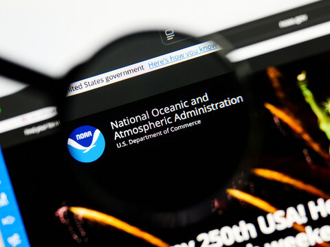 Milan, Italy 2026, 5 Jul Closeup of National Oceanic and Atmospheric Administration website page on a laptop screen. Focus on logo under a magnifying glass.