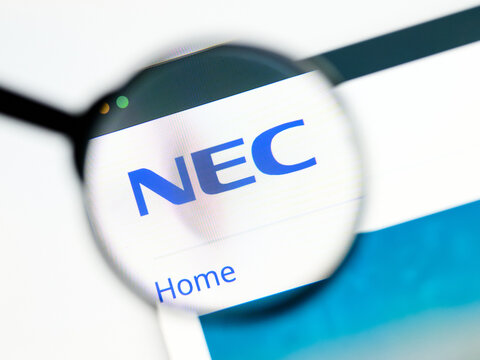 Milan, Italy 2026, 5 Jul Closeup of NEC website page on a laptop screen. Focus on NEC logo under a magnifying glass.