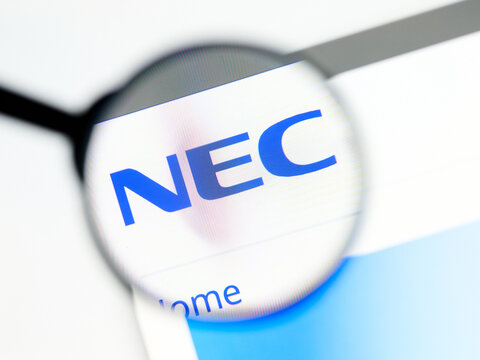 Milan, Italy 2026, 5 Jul Closeup of NEC website page on a laptop screen. Focus on NEC logo under a magnifying glass.