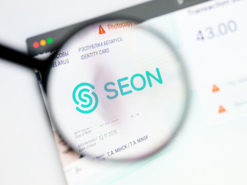Milan, Italy 2026, 5 Jul Closeup of SEON website page on a laptop screen. Focus on SEON logo under a magnifying glass.
