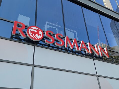 Warsaw, Poland,May 03, 2026. Exterior sign of Rossmann drugstore on a modern glass facade building under clear daylight. High quality photograph.
