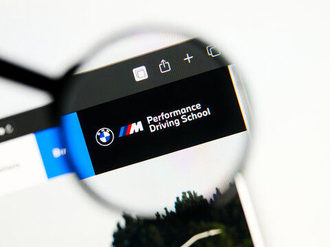 Milan, Italy 2026, 5 Jul Closeup of BMW Performance Driving School website page on a laptop screen. Focus on BMW Performance Driving School logo under a magnifying glass.