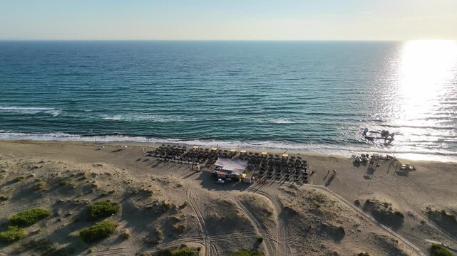 Kalogria, Achaea is a small coastal settlement and renowned sandy beach located in Western Greece, roughly 45 km southwest of your location in Patras. Famous for its 9-kilometer golden shoreline, turq