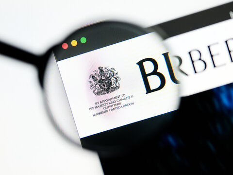 Milan, Italy 2026, 5 Jul Closeup of Burberry website page on a laptop screen. Focus on Burberry logo under a magnifying glass.