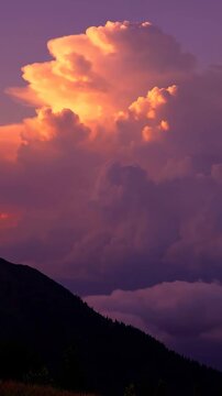 Dramatic Golden Sunset Clouds over Mountain Silhouette for cinematic vertical backgrounds Vertical. Video. Portrait Orientation.