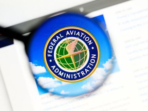 Milan, Italy 2026, 5 Jul Closeup of Federal Aviation Administration website page on a laptop screen. Focus on Federal Aviation Administration logo under a magnifying glass.