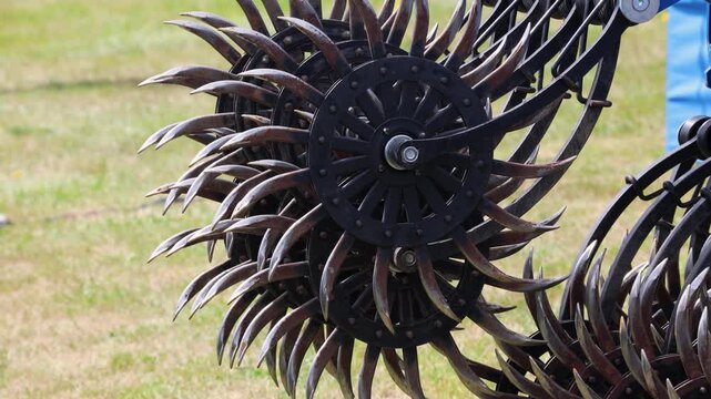 Rotary harrow cultivator machinery with soil tillage disc tine equipment on blue agricultural frame