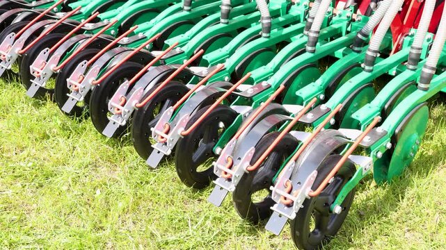 Seed drill pneumatic seeder agriculture machinery with equipment hose tractor attachment in field operation