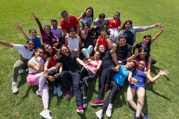 Fototapeta premium portrait of Latin sporty group of people after training workout outdoors in Mexico Latin America, large and diverse group of hispanic people of different ages and multi age