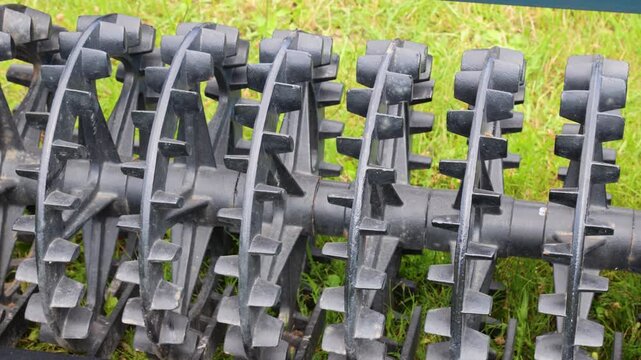 Roller packer agriculture machinery with soil metal equipment ring attachment featuring ridge elements