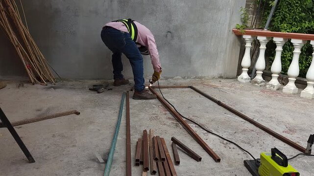 Welder squaring and joining metal profiles with arc welding