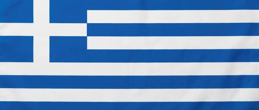 Close-up view of the flag of Greece, showing its distinct blue and white stripes and cross