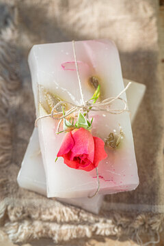Handmade and ecological rose soap in summer garden