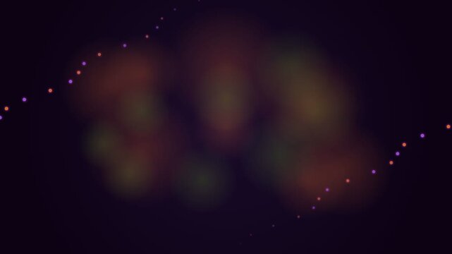 A diagonal string of glowing multicolored lights against a dark background