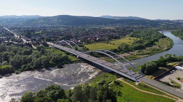 Drone shot of Pilsudski bridge (Helenski bridge) over Dunajec river, Nowy Sacz