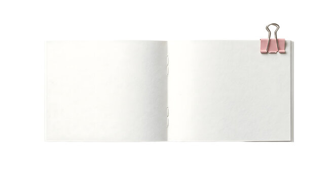 Open blank horizontal notebook with pink binder clip