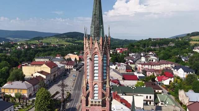 Drone shot of Saint Catherine of Alexandria church tower in Grybow, Poland