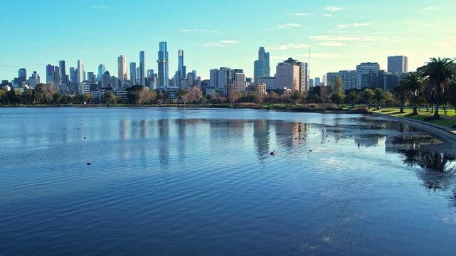 Sunrise view of Yarra river and Melbourne skyscrapers business office building with evening skyline in Albert Park, Victoria, Australia