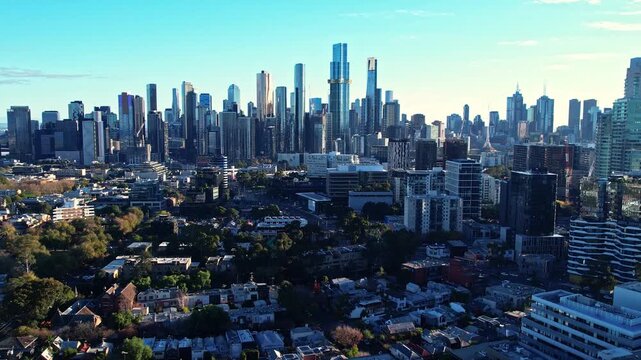 Sunrise view of Yarra river and Melbourne skyscrapers business office building with evening skyline in Albert Park, Victoria, Australia