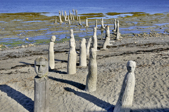 Le Grand Rassemblement - "The Great Gathering" stonework statues leading into the St. Laurence River in Sainte-Flavie, Gaspesie, Quebec, Canada.