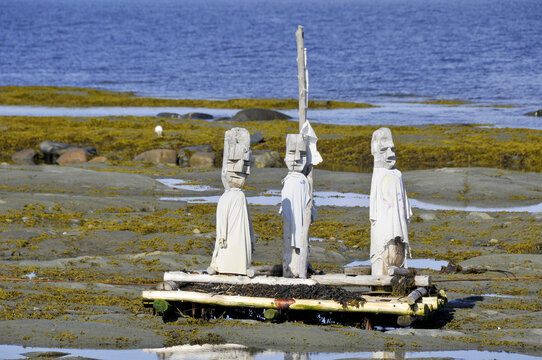 Le Grand Rassemblement - "The Great Gathering" stonework statues leading into the St. Laurence River in Sainte-Flavie, Gaspesie, Quebec, Canada.