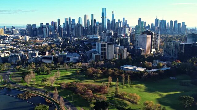 Sunrise view of Yarra river and Melbourne skyscrapers business office building with evening skyline in Albert Park, Victoria, Australia