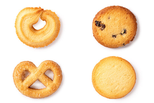 Delicious set of four different butter cookies including pretzel shape, raisin, and classic round biscuits. Sweet crispy bakery snacks isolated on a white background.