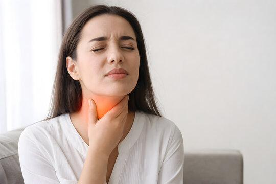 Woman Touching Painful Throat With Warm Glow
