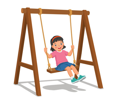 Little girl playing on the swings in the park
