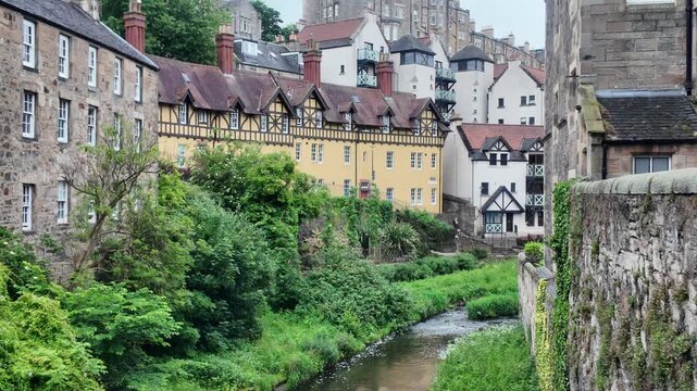 Historic 12th-century milling enclave of Dean Village with red sandstone and timbered architecture, Edinburgh, Scotland.