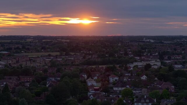 Aerial Sunset Over a Kettering Neighborhood and Park With Dramatic Cloudy Horizon