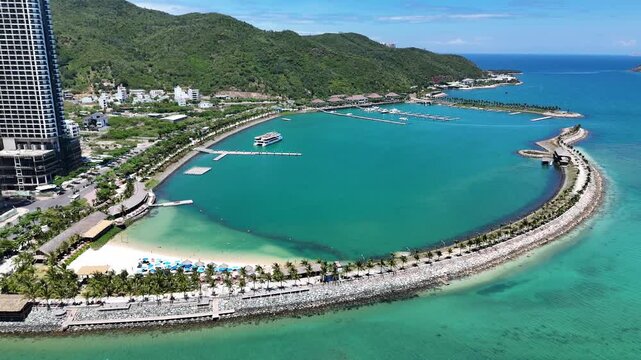 Aerial view of luxury Ana Marina Nha Trang with beach club and bay for yachts. Northern part of city, central Vietnam.