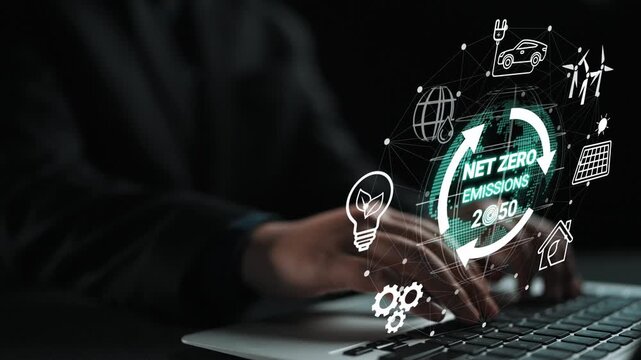 Businessperson Working on Laptop with Digital Net Zero Emissions Concept Representing Sustainable Future Goals and Innovations for 2050. Entropy.