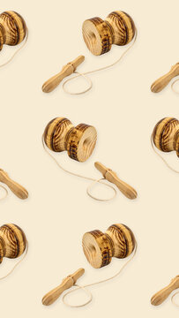 Chilean patriotic celebration vertical background 9:16 for mobile wallpapers with seamless pattern of traditional wooden emboque toys on beige backdrop
