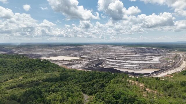 Aerial view of coal mining, land full of excavation holes